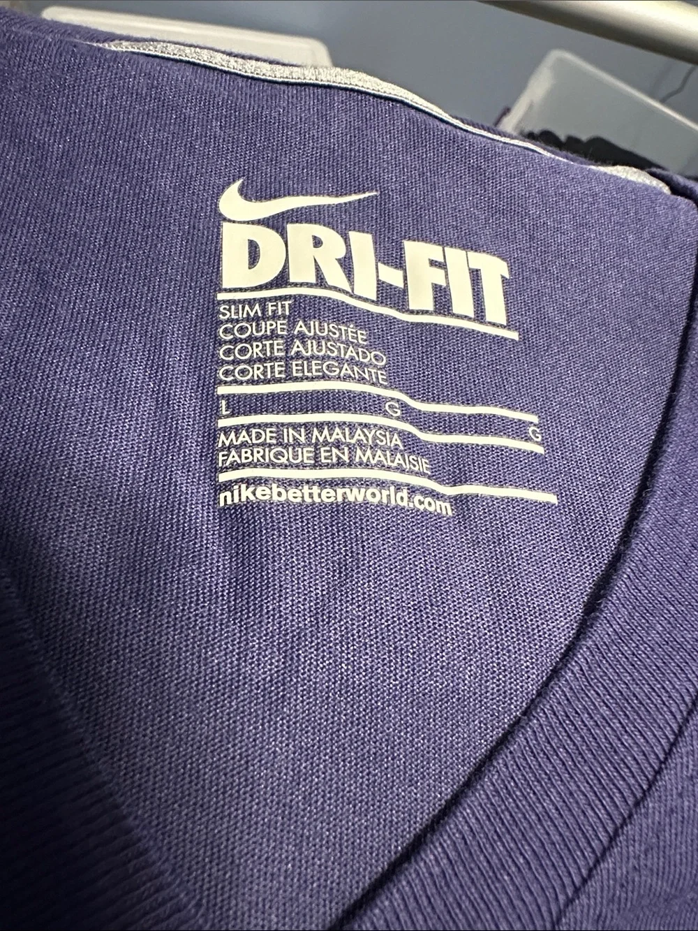 Nike Women's V-Neck Tee in Deep Purple with Yellow 'Victory Freak' Graphic